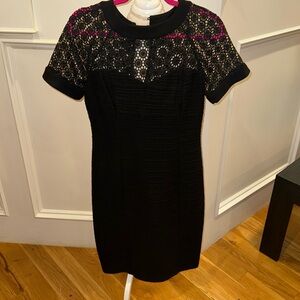 Classic black dress with stylish top and shape wear underneath